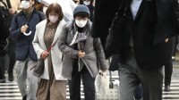 御寒又节能 日本东京政府鼓励民众穿高领毛衣
