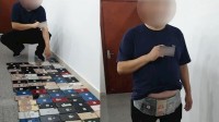 男子身绑整100台手机进境 因肚子太大被截查