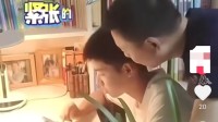男孩中考870分一脸淡定 与紧张的父亲形成鲜明对比