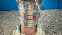 女子藏匿Switch卡带入境被查：两只腿共绑了105张